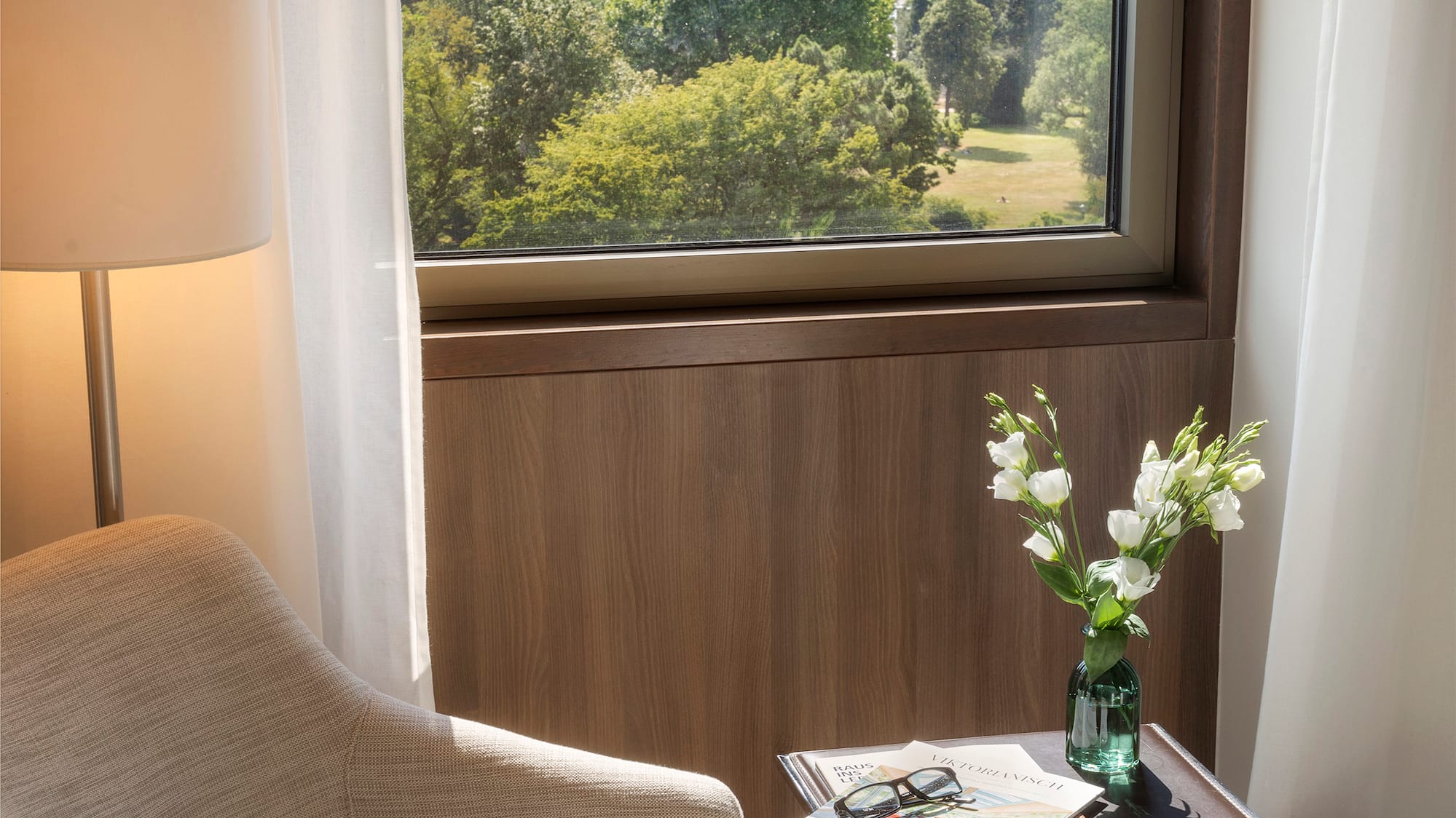 a chair and a table with flowers outside