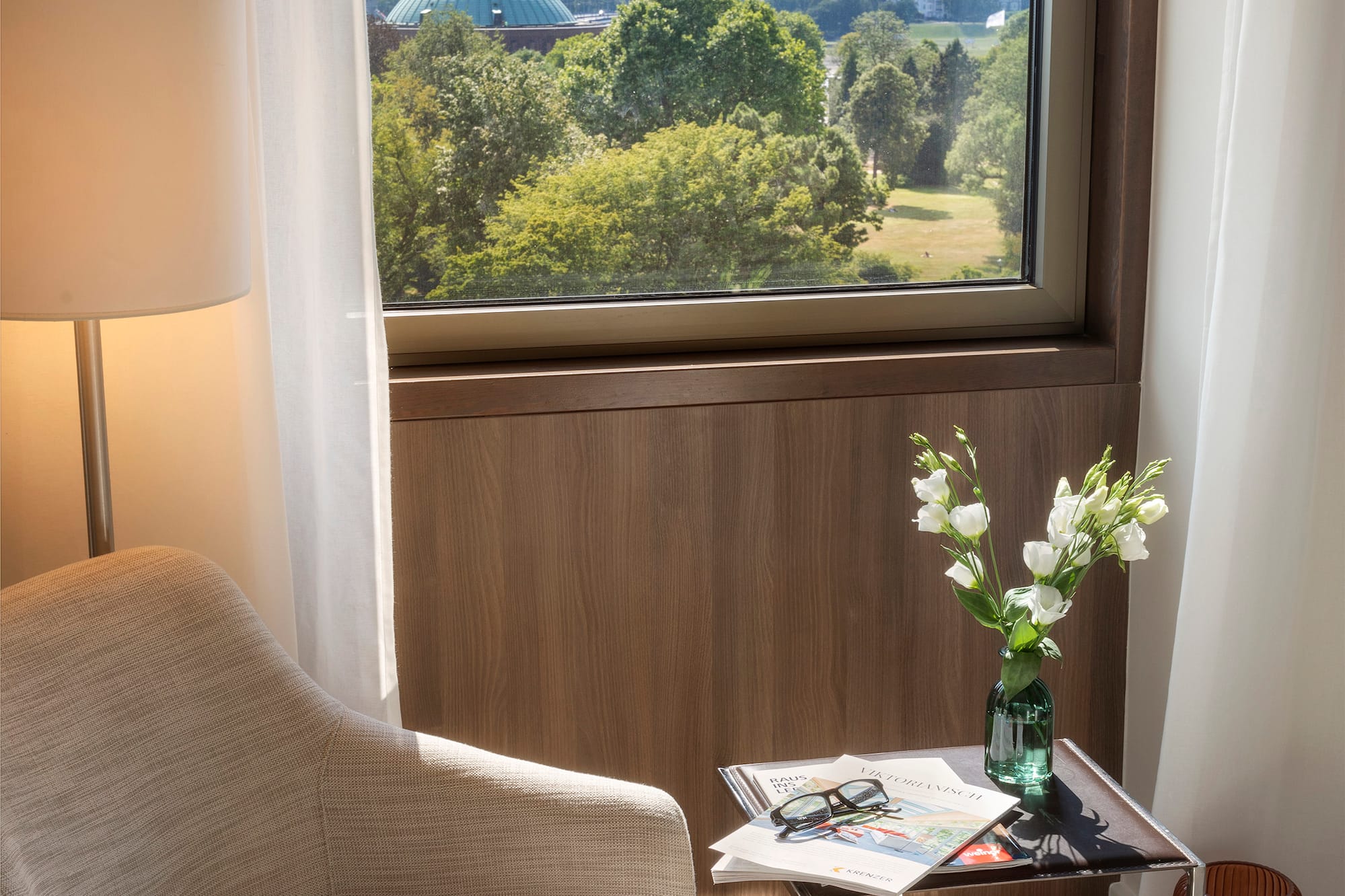 a chair and a table with flowers outside