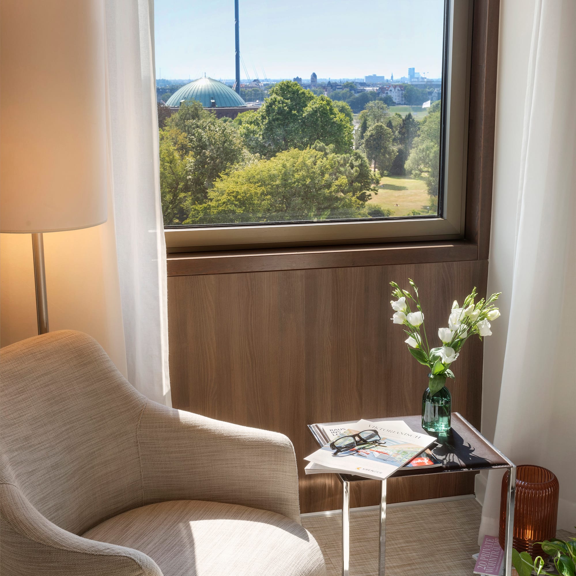 a chair and a table with flowers outside