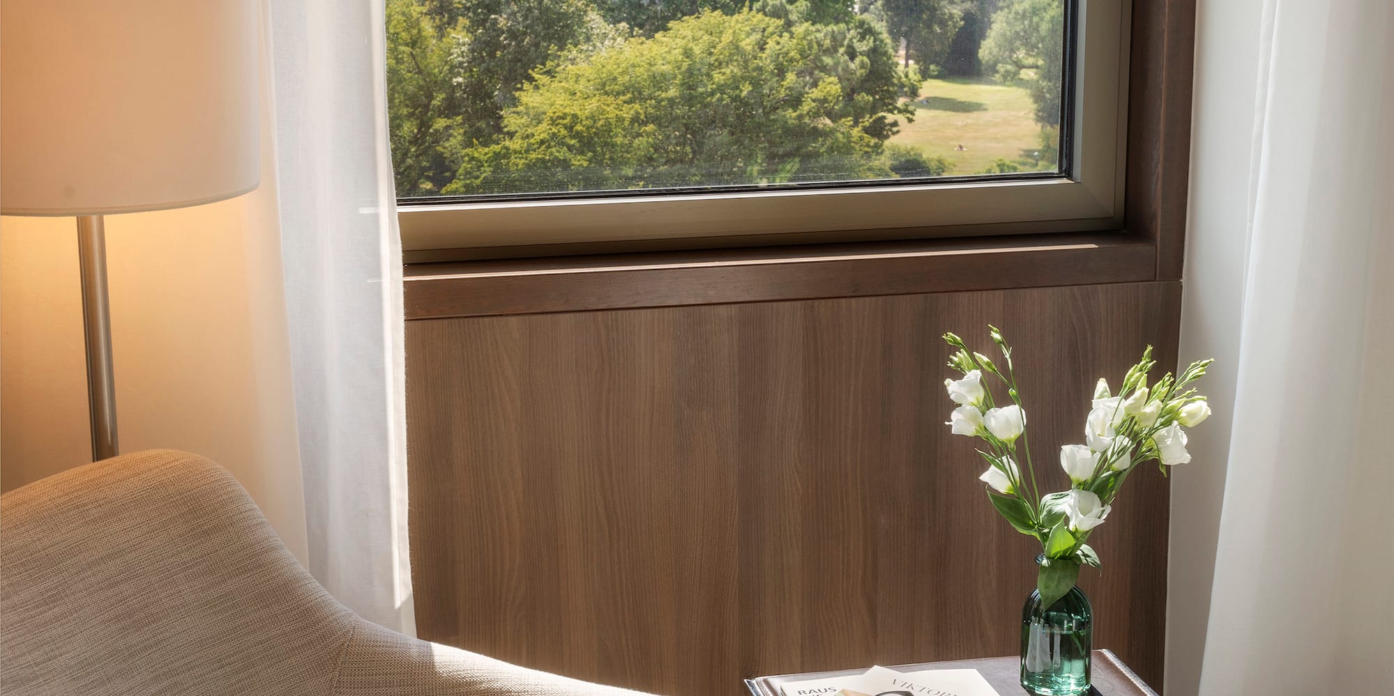 a chair and a table with flowers outside