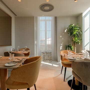 a room with tables and chairs