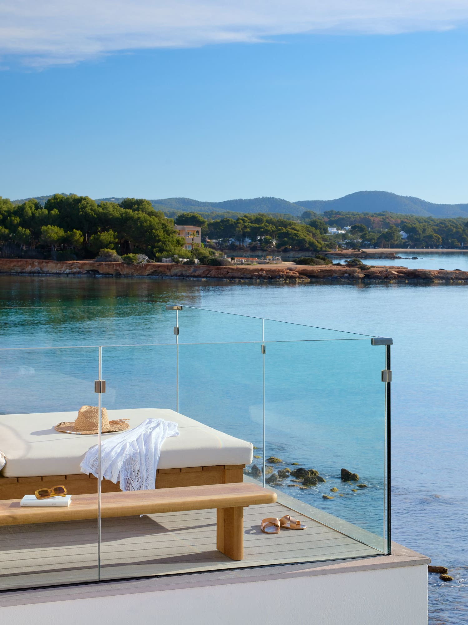 a deck chair overlooking a body of water