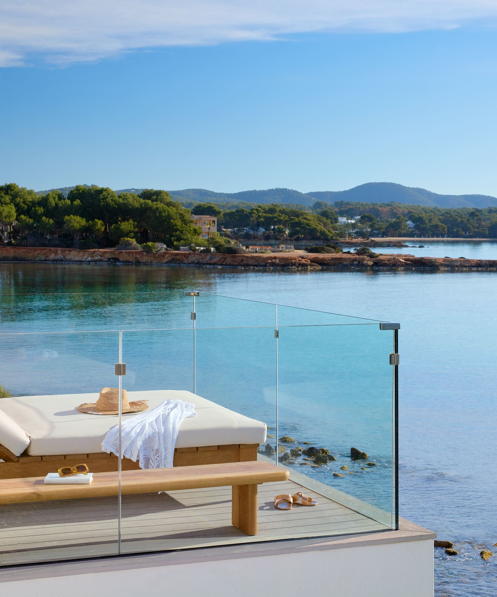 a deck chair overlooking a body of water