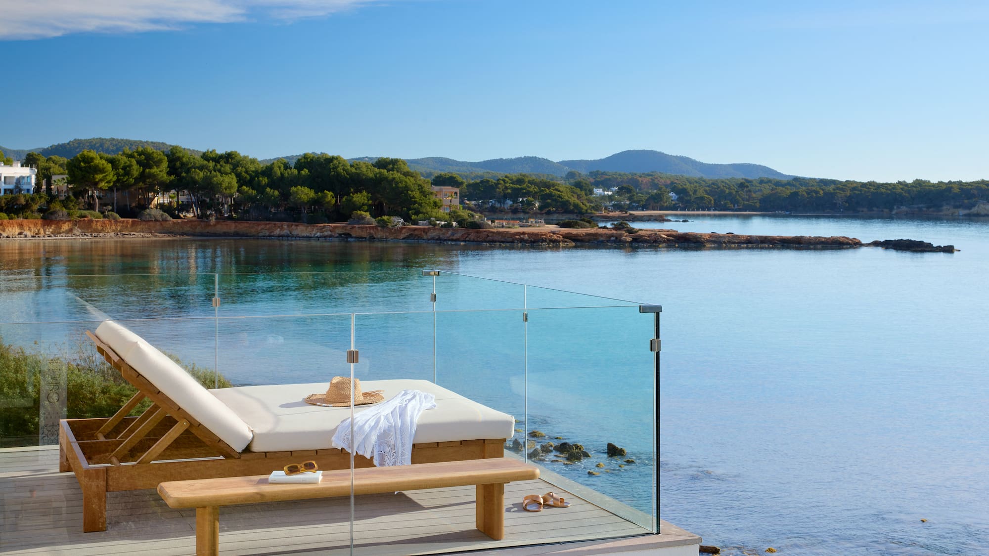 a deck chair overlooking a body of water