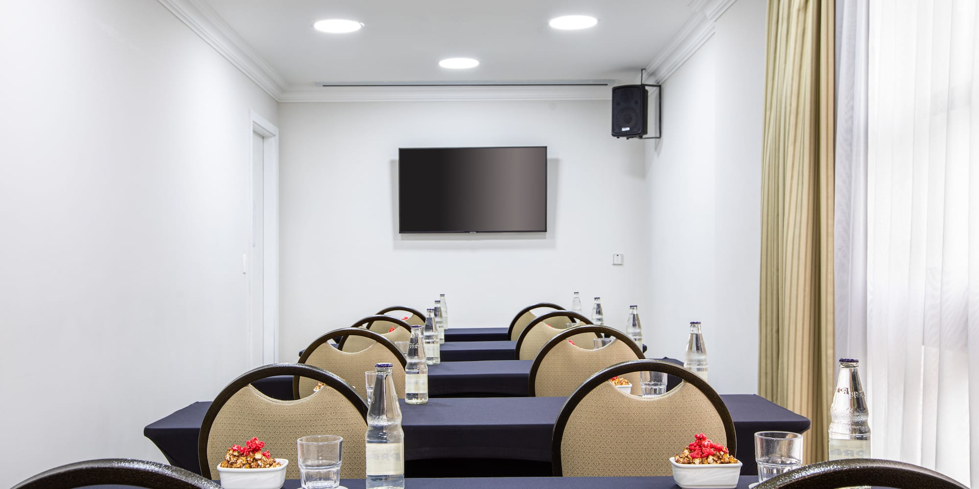 a room with tables and chairs