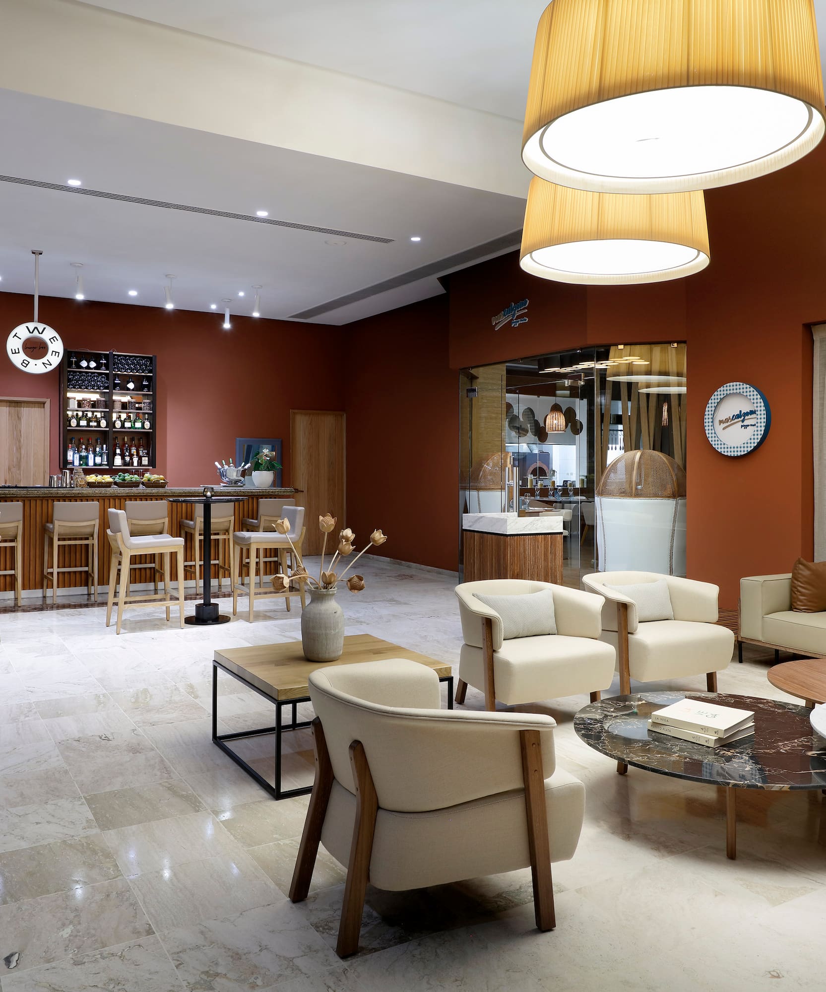 a room with a bar and chairs