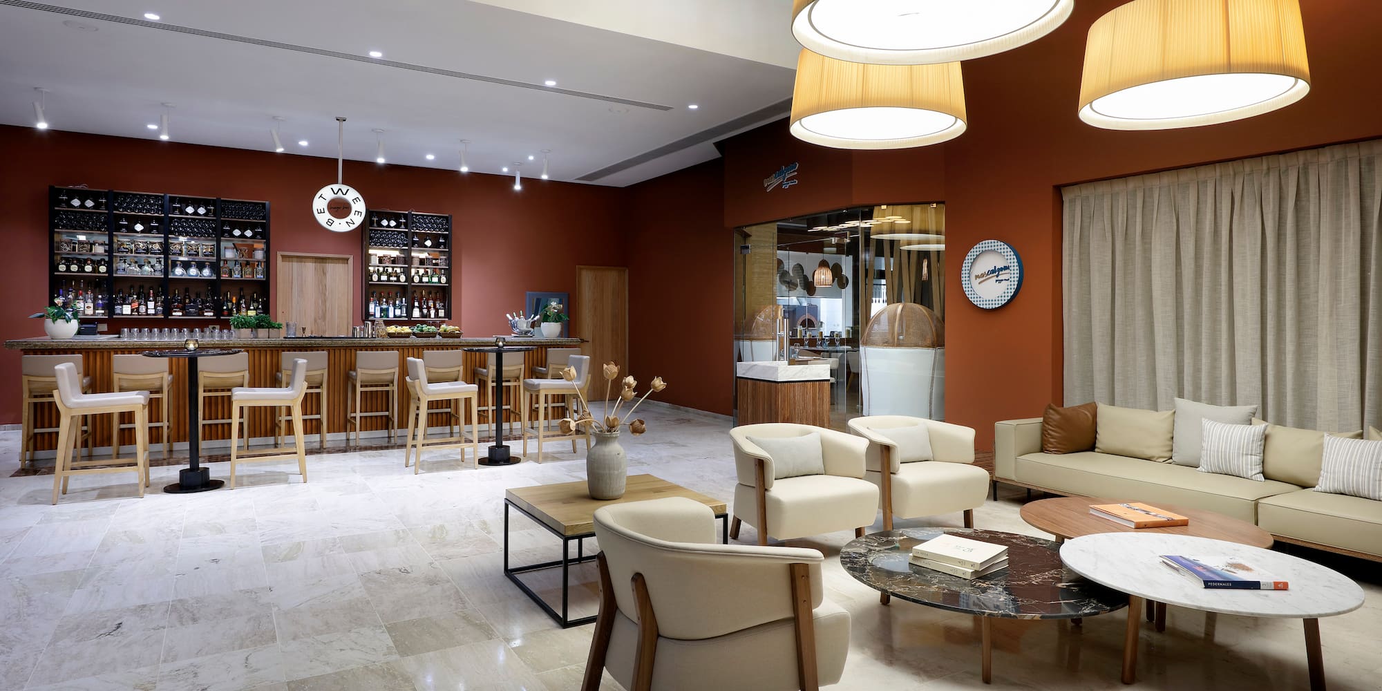 a room with a bar and chairs