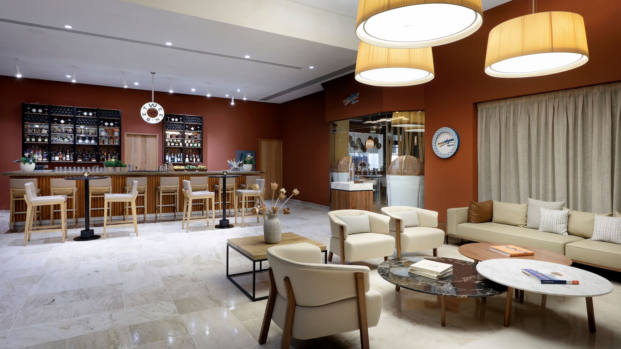 a room with a bar and chairs