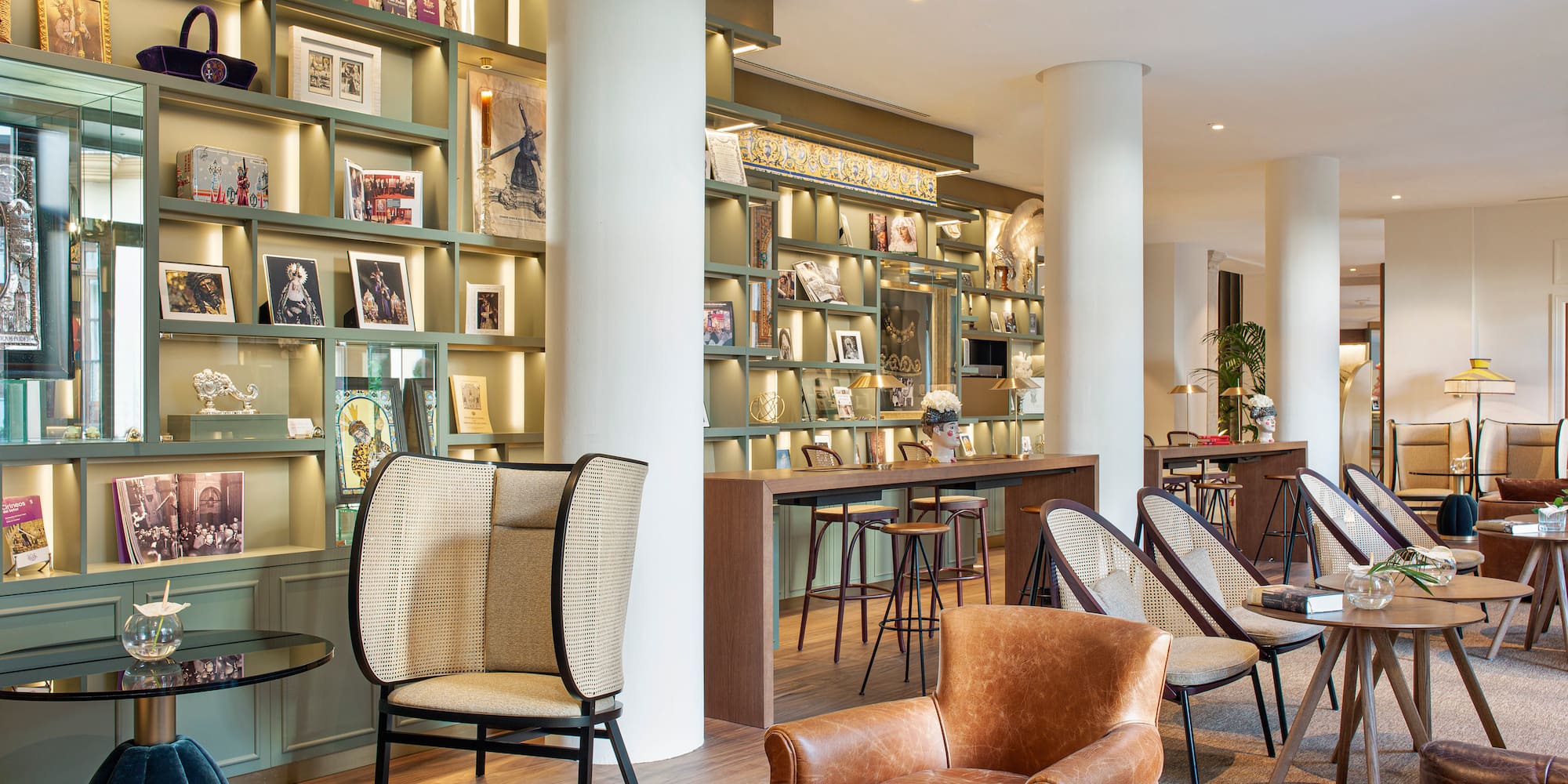 a room with a large white column and chairs