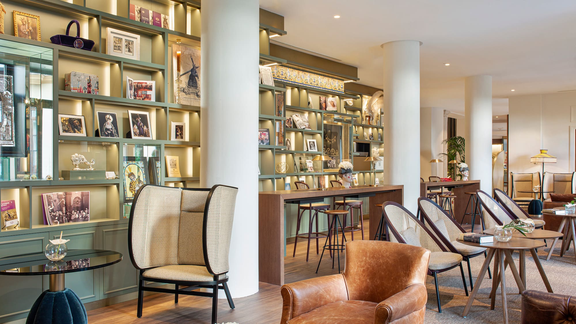 a room with a large white column and chairs