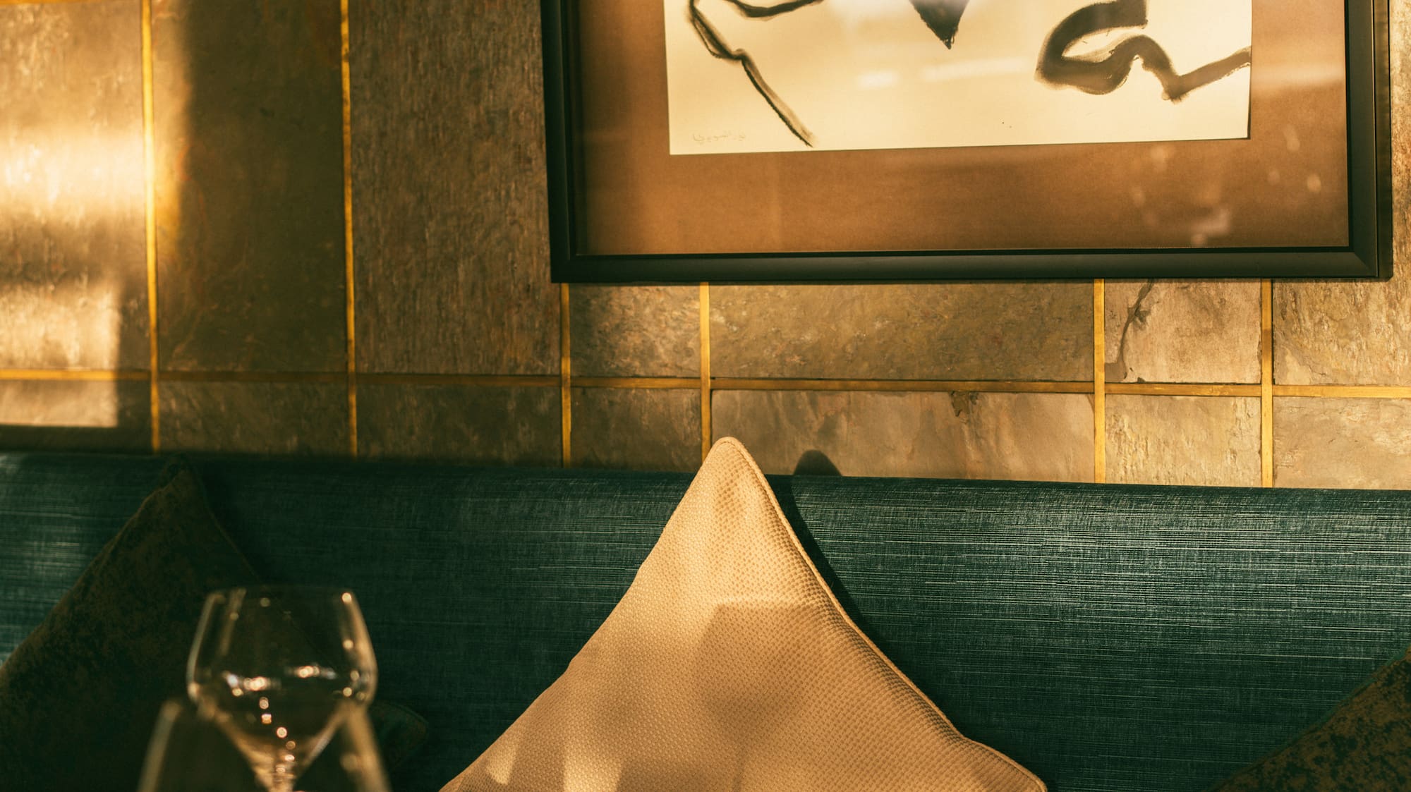 a table with a painting on the wall