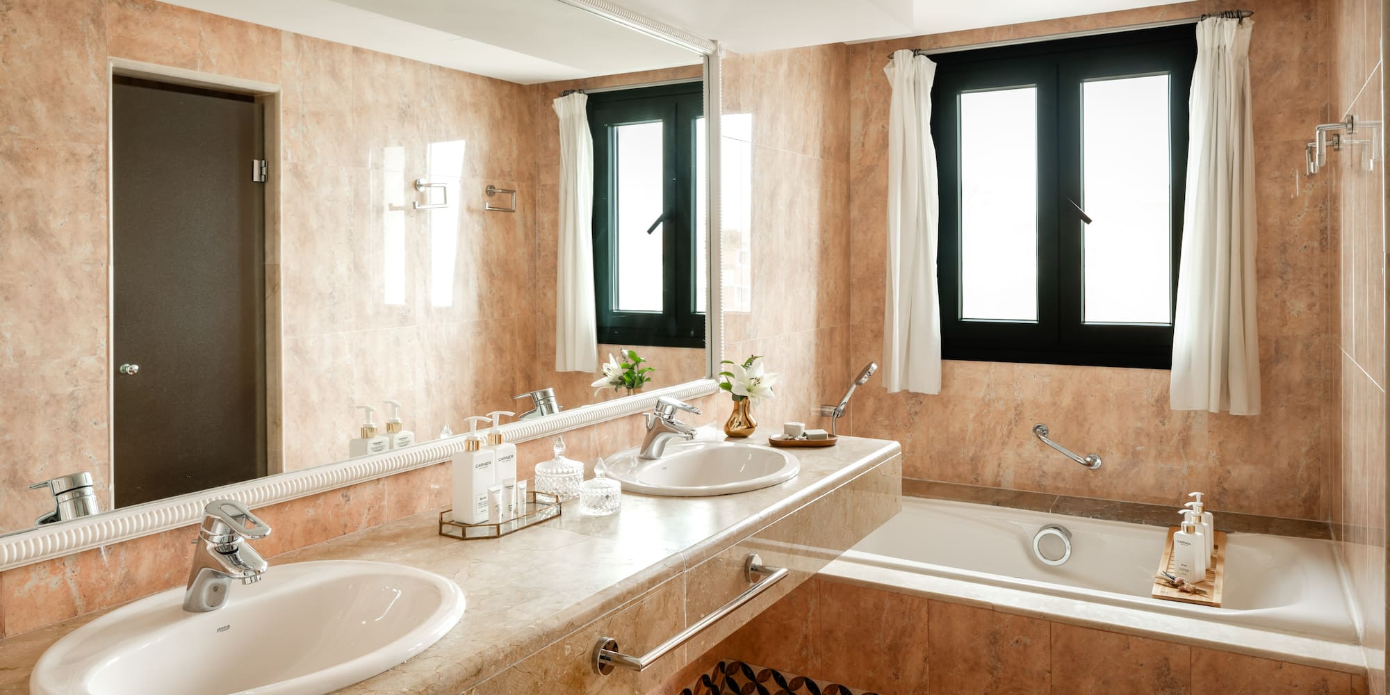 a bathroom with a large sink and tub