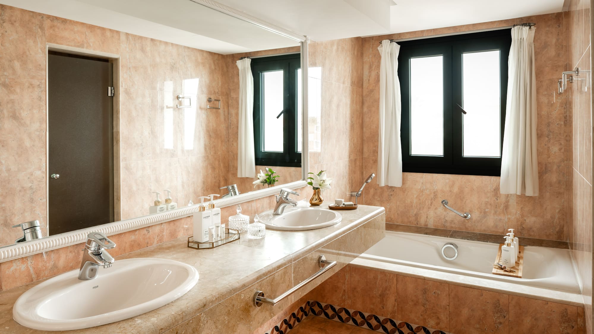 a bathroom with a large sink and tub