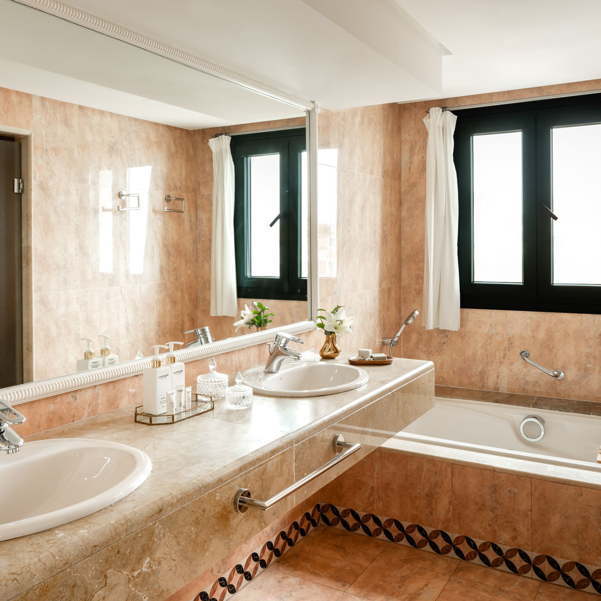 a bathroom with a large sink and tub