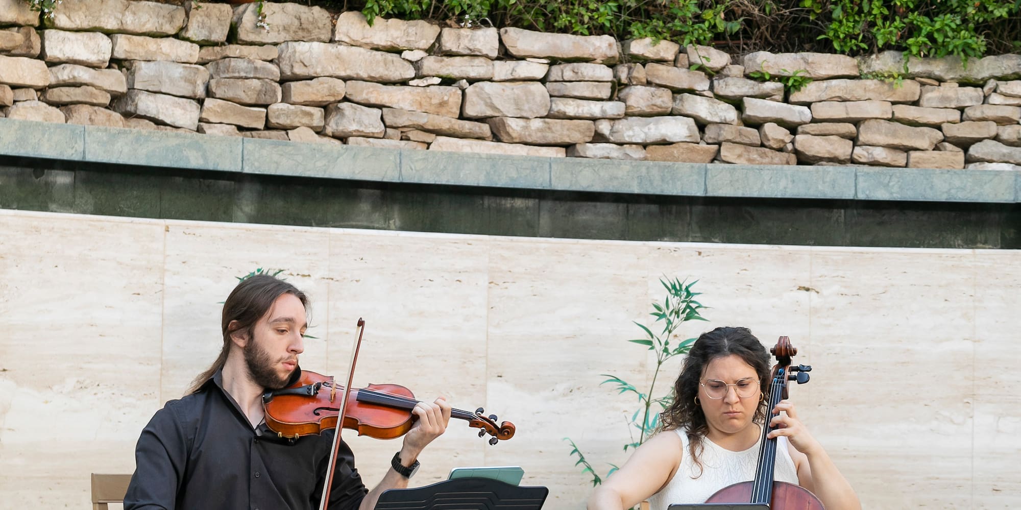 a man and woman playing instruments