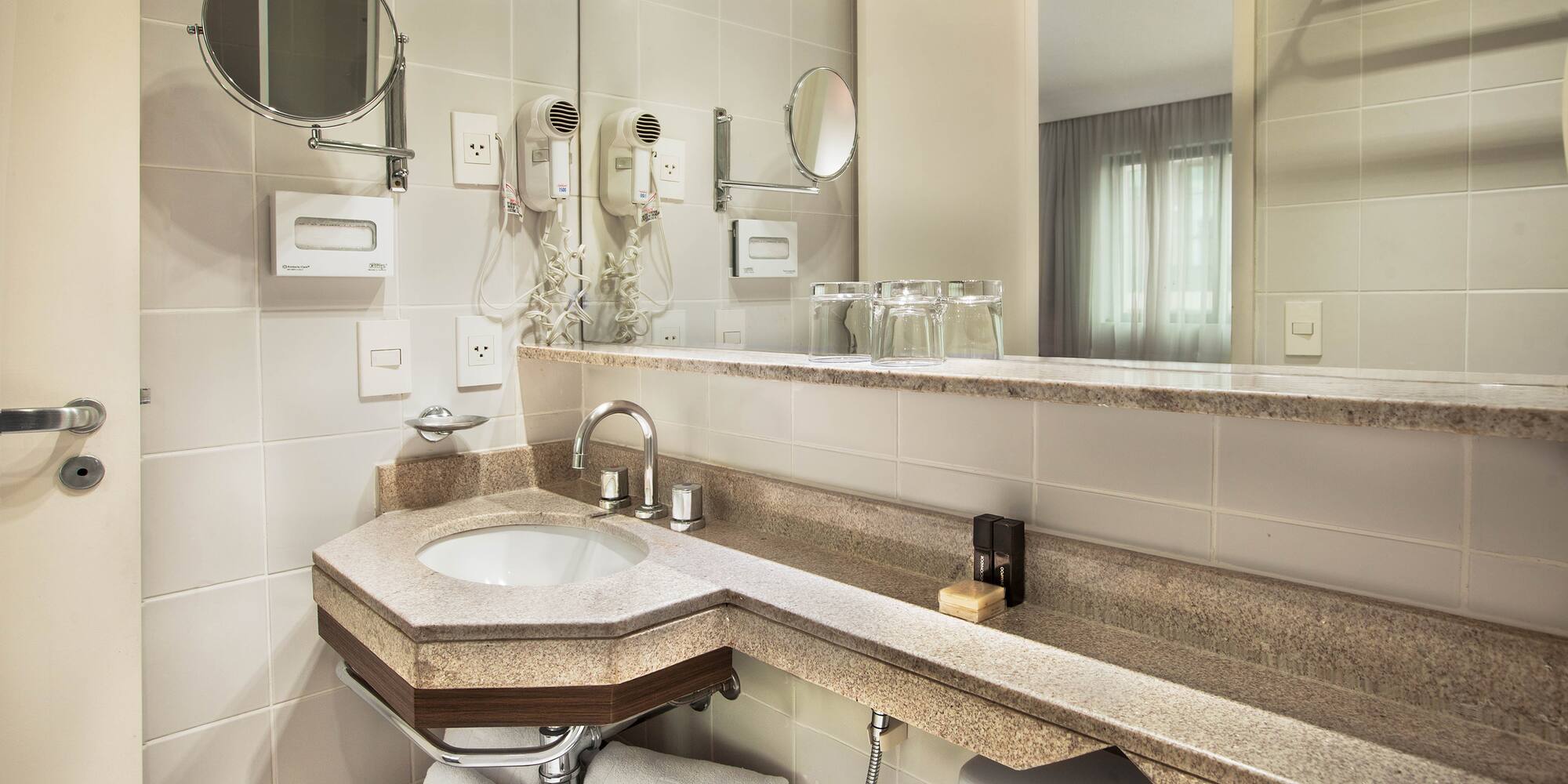 a bathroom with a sink and mirror