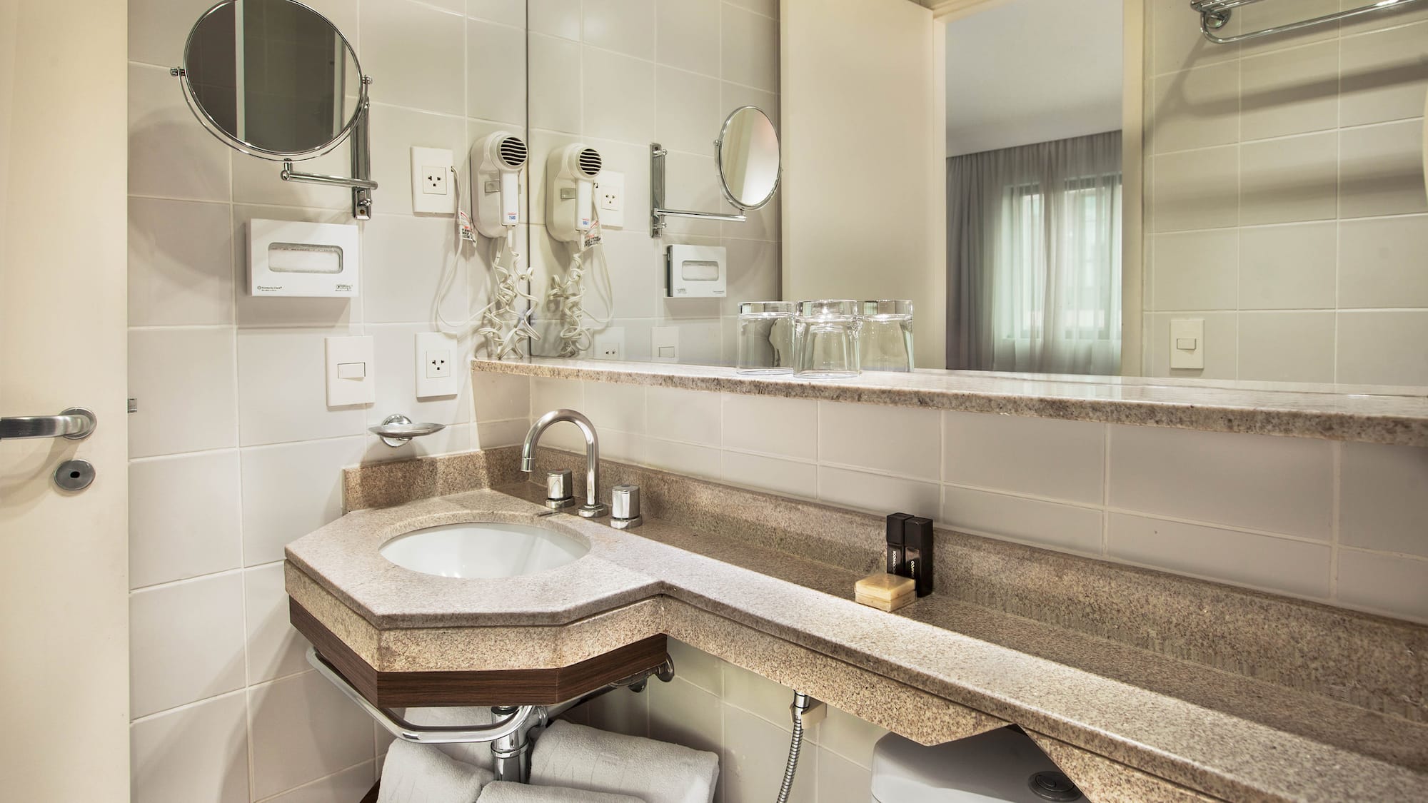 a bathroom with a sink and mirror