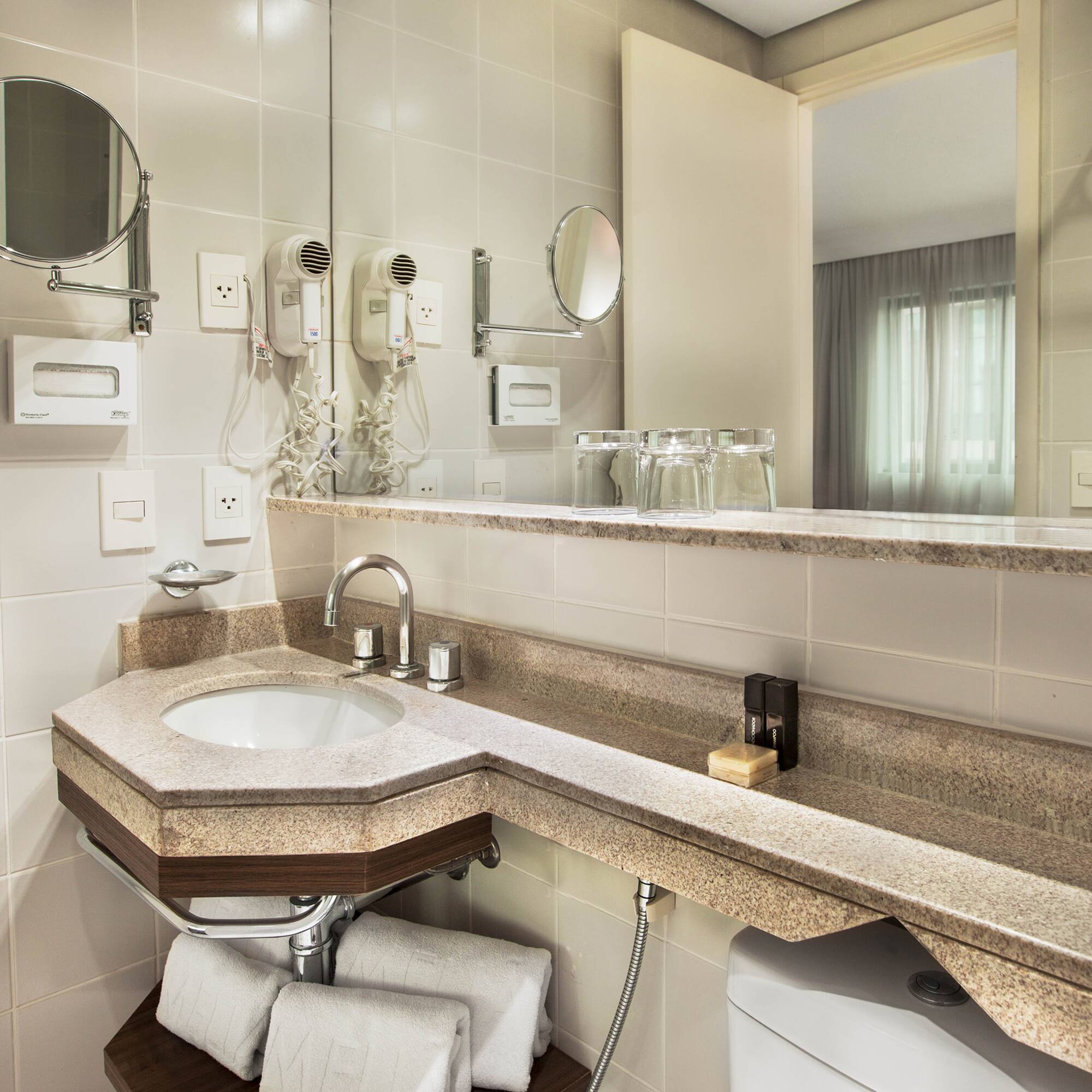 a bathroom with a sink and mirror