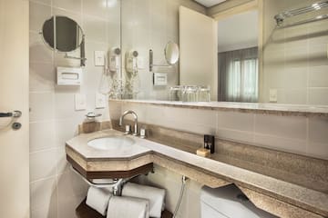 a bathroom with a sink and mirror