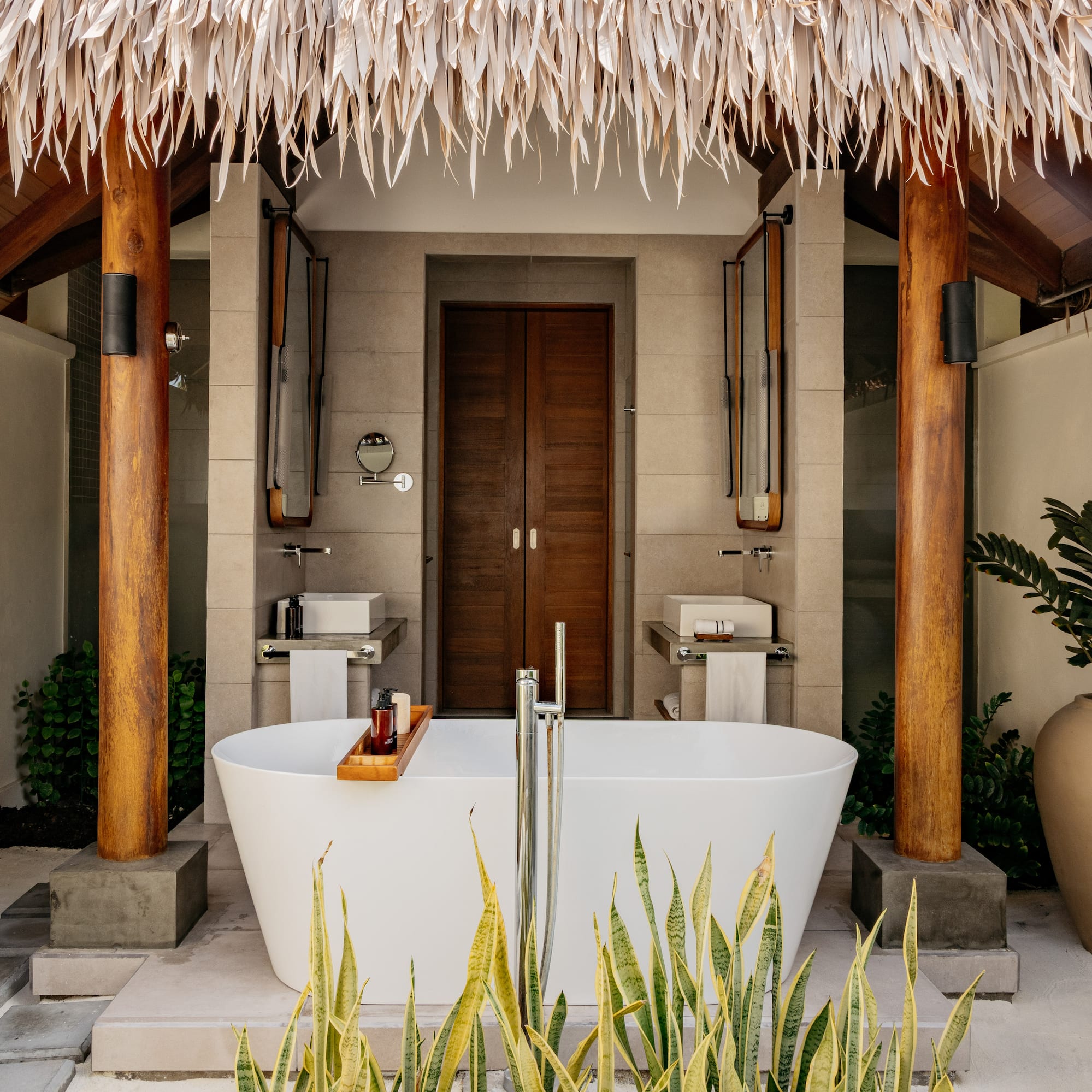 a bathroom with a tub and a shower