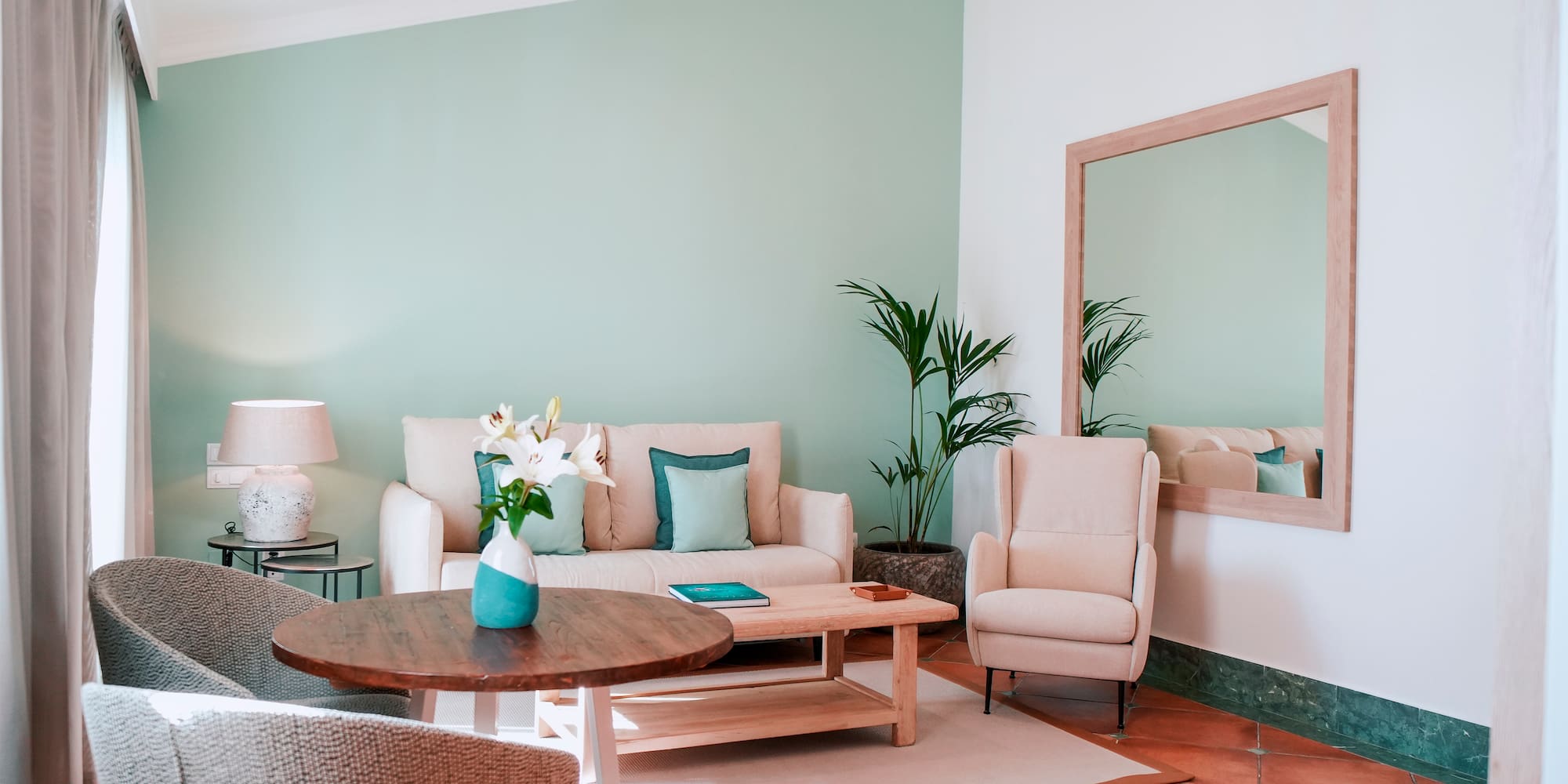 a living room with a couch and chairs