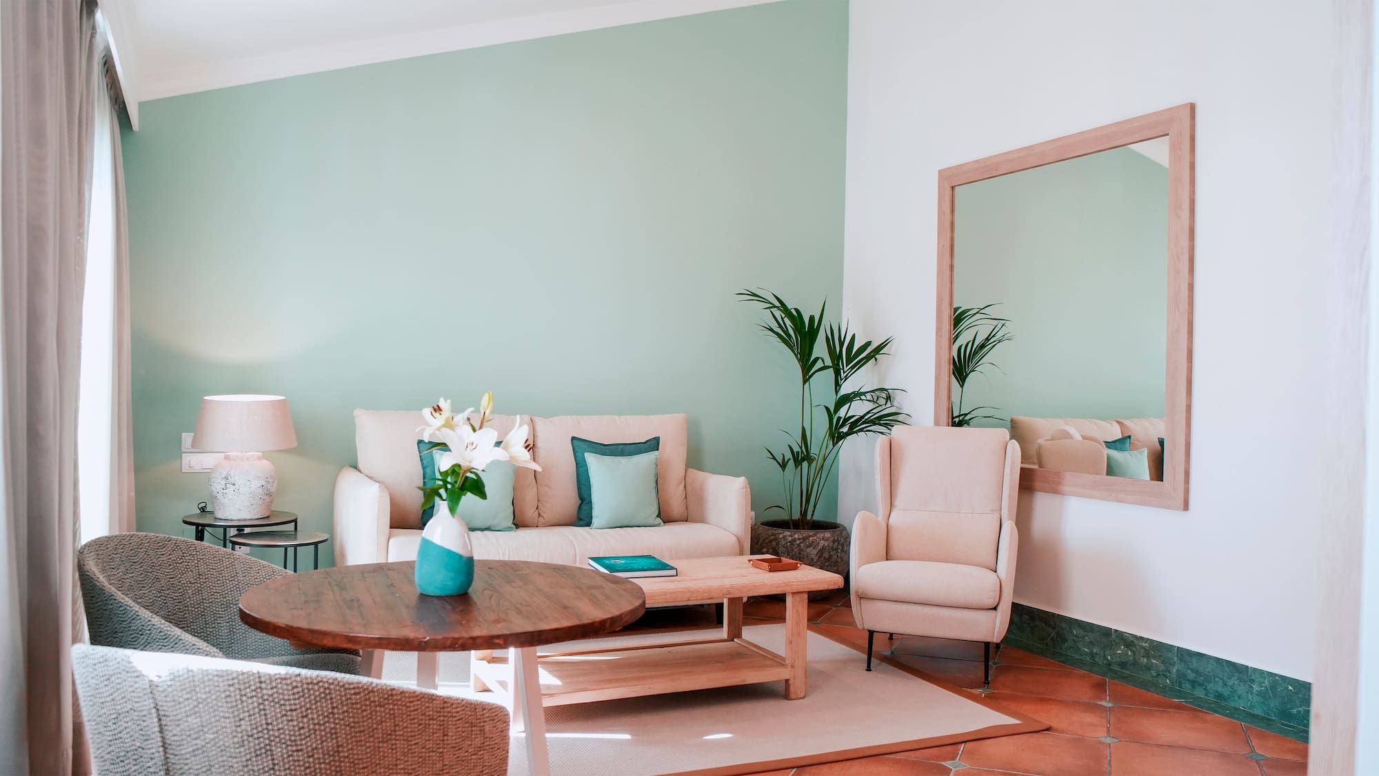 a living room with a couch and chairs