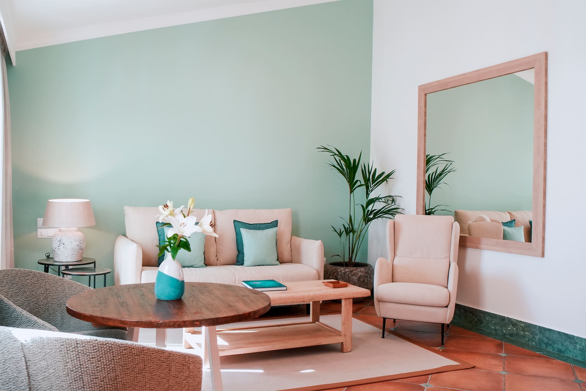 a living room with a couch and chairs