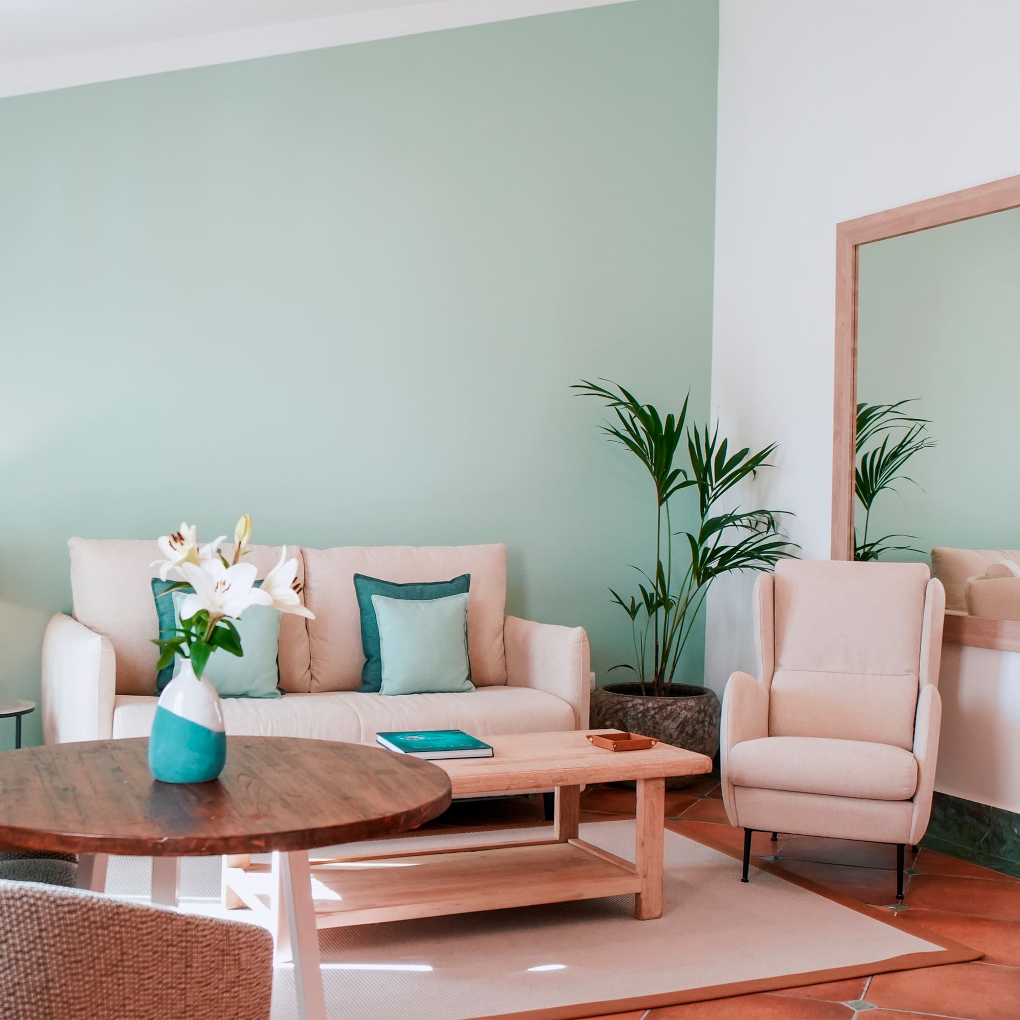 a living room with a couch and chairs