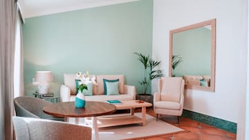 a living room with a couch and chairs