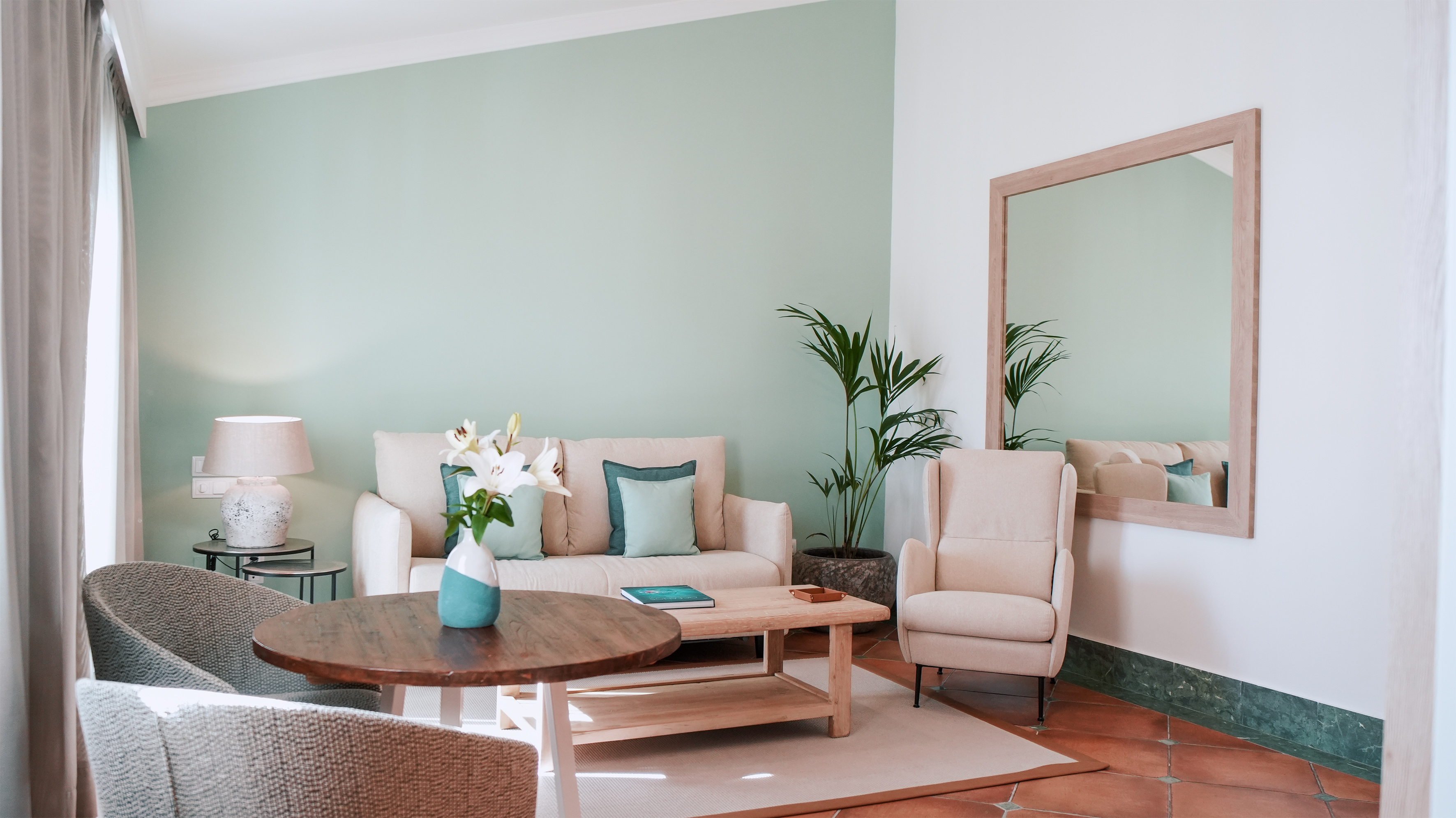 a living room with a couch and chairs