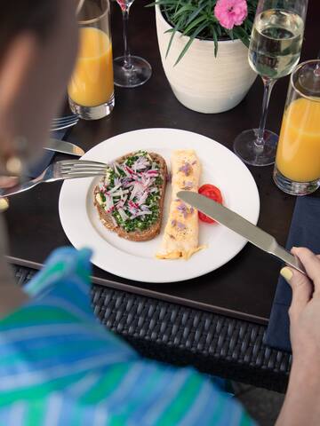 a woman eating food on a plate