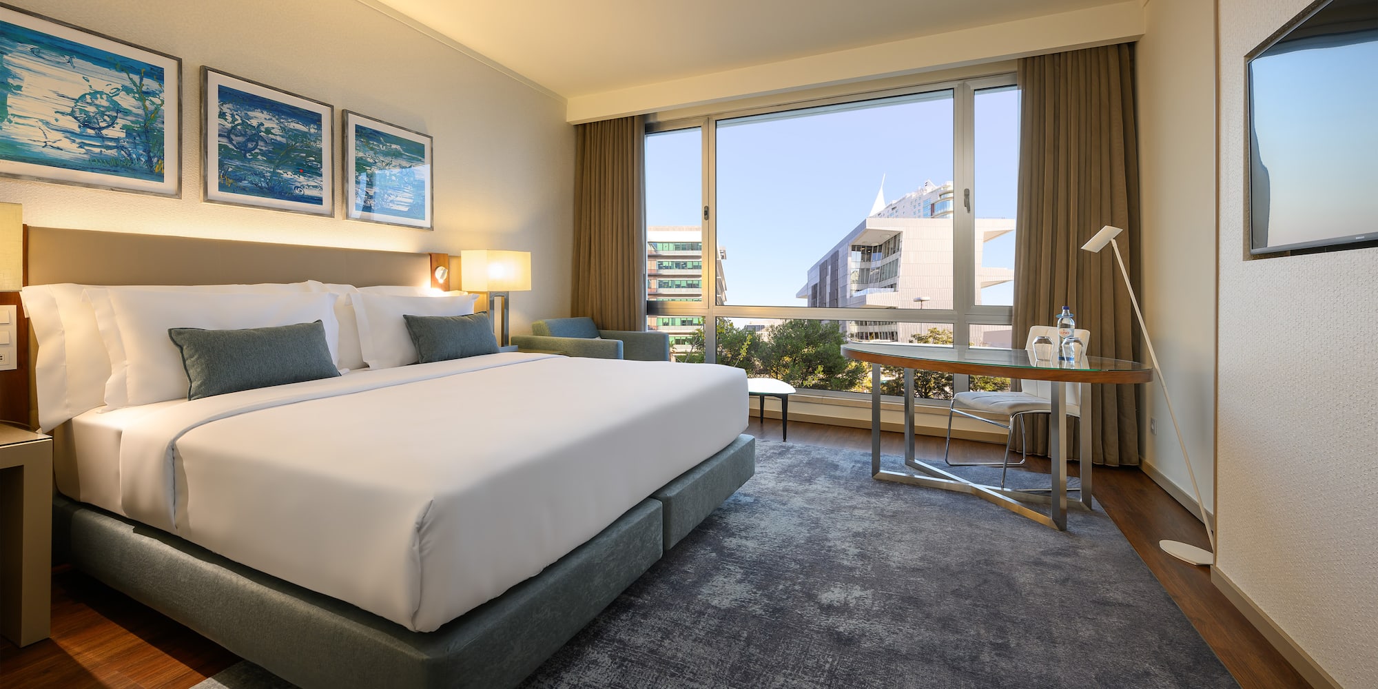 a hotel room with a bed and a table