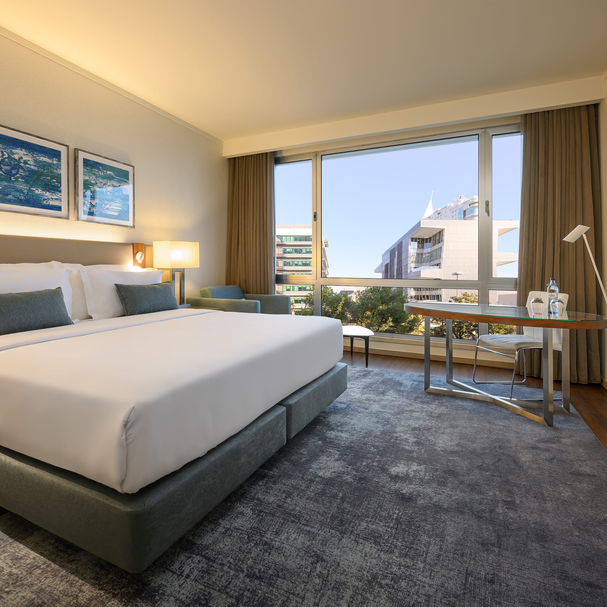 a hotel room with a bed and a table