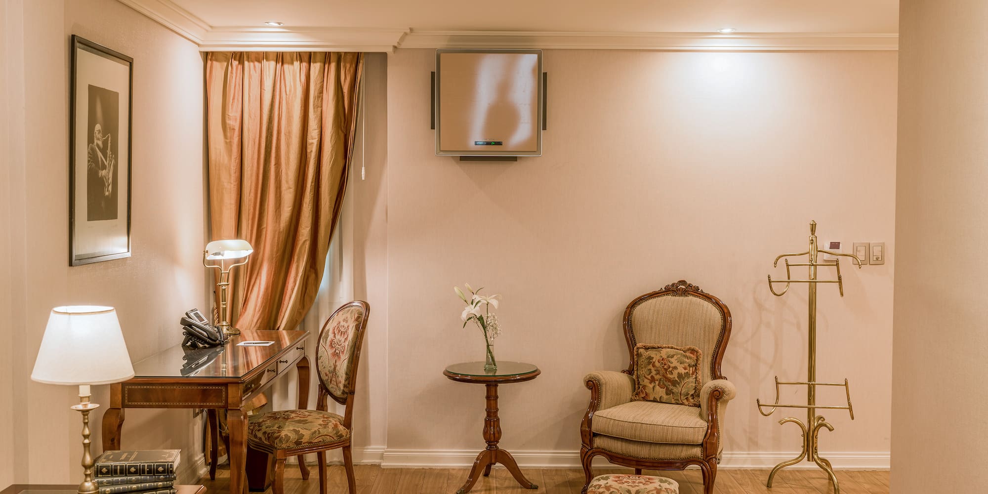 a room with a desk and chairs