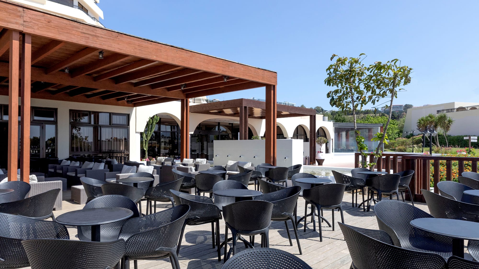 a patio with tables and chairs