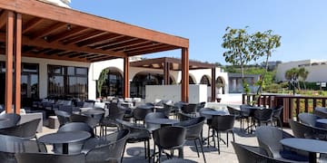a patio with tables and chairs