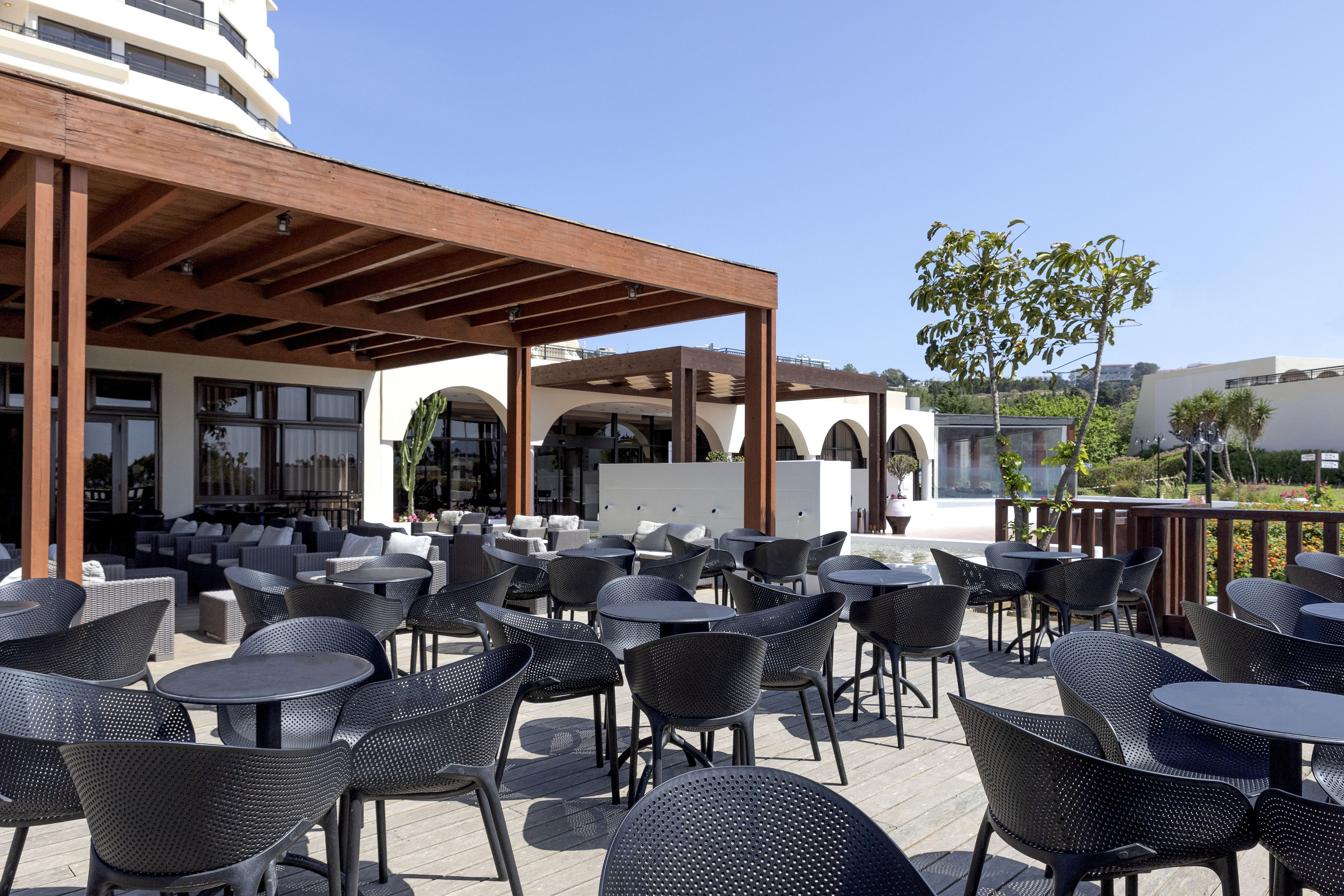 a patio with tables and chairs