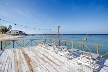 chairs on a deck overlooking the water