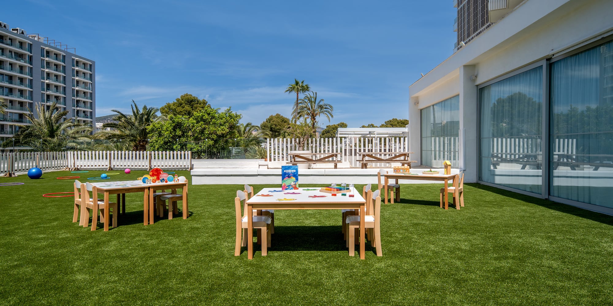 a table and chairs on a lawn