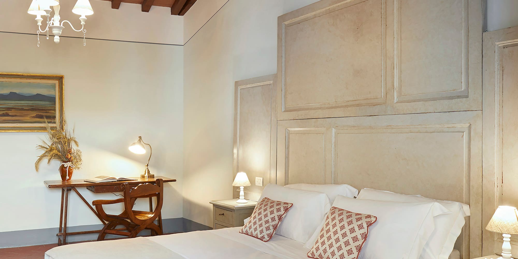 a bedroom with a bed and a desk