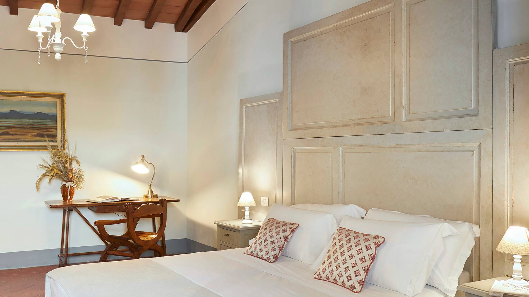 a bedroom with a bed and a desk