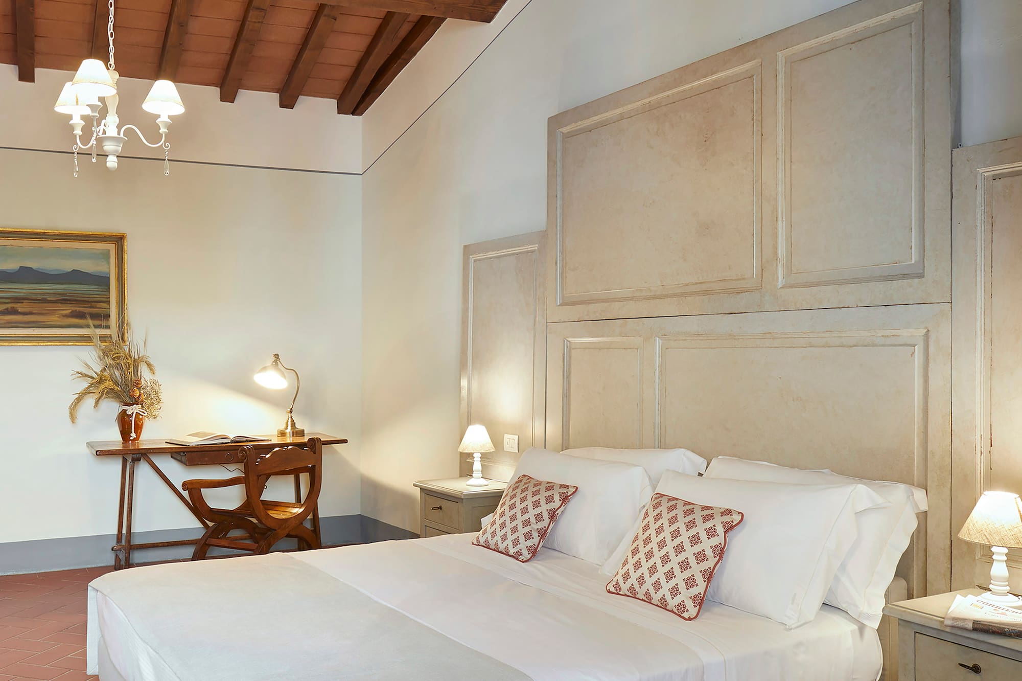 a bedroom with a bed and a desk