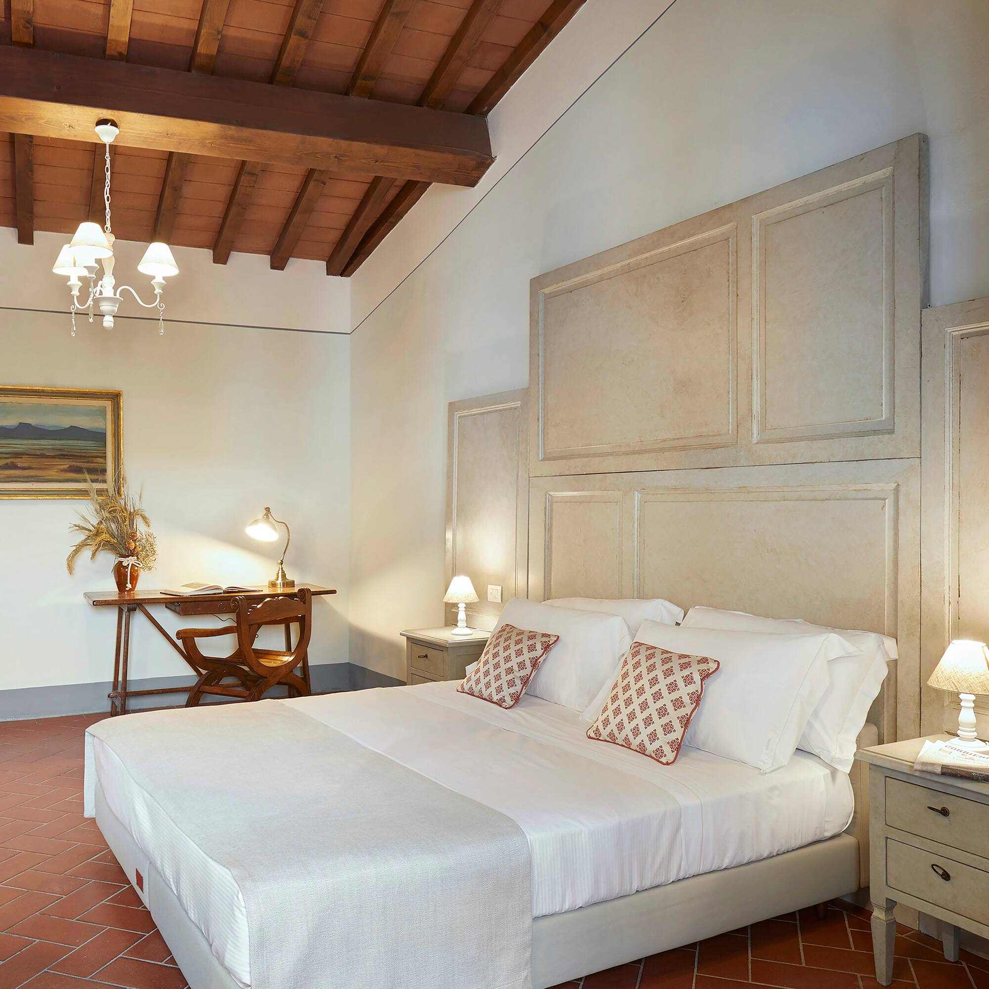 a bedroom with a bed and a desk