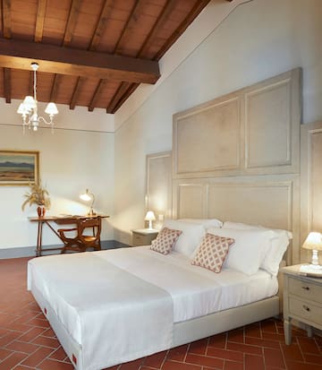 a bedroom with a bed and a desk