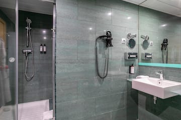 a bathroom with a shower and a sink