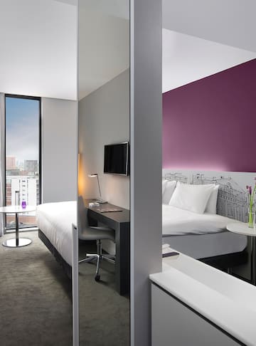 a room with a bed and a desk