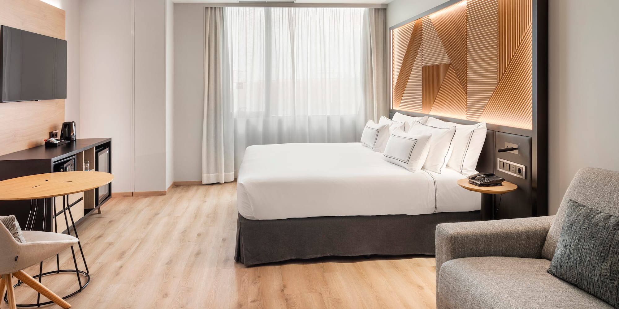 a room with a bed and a tv