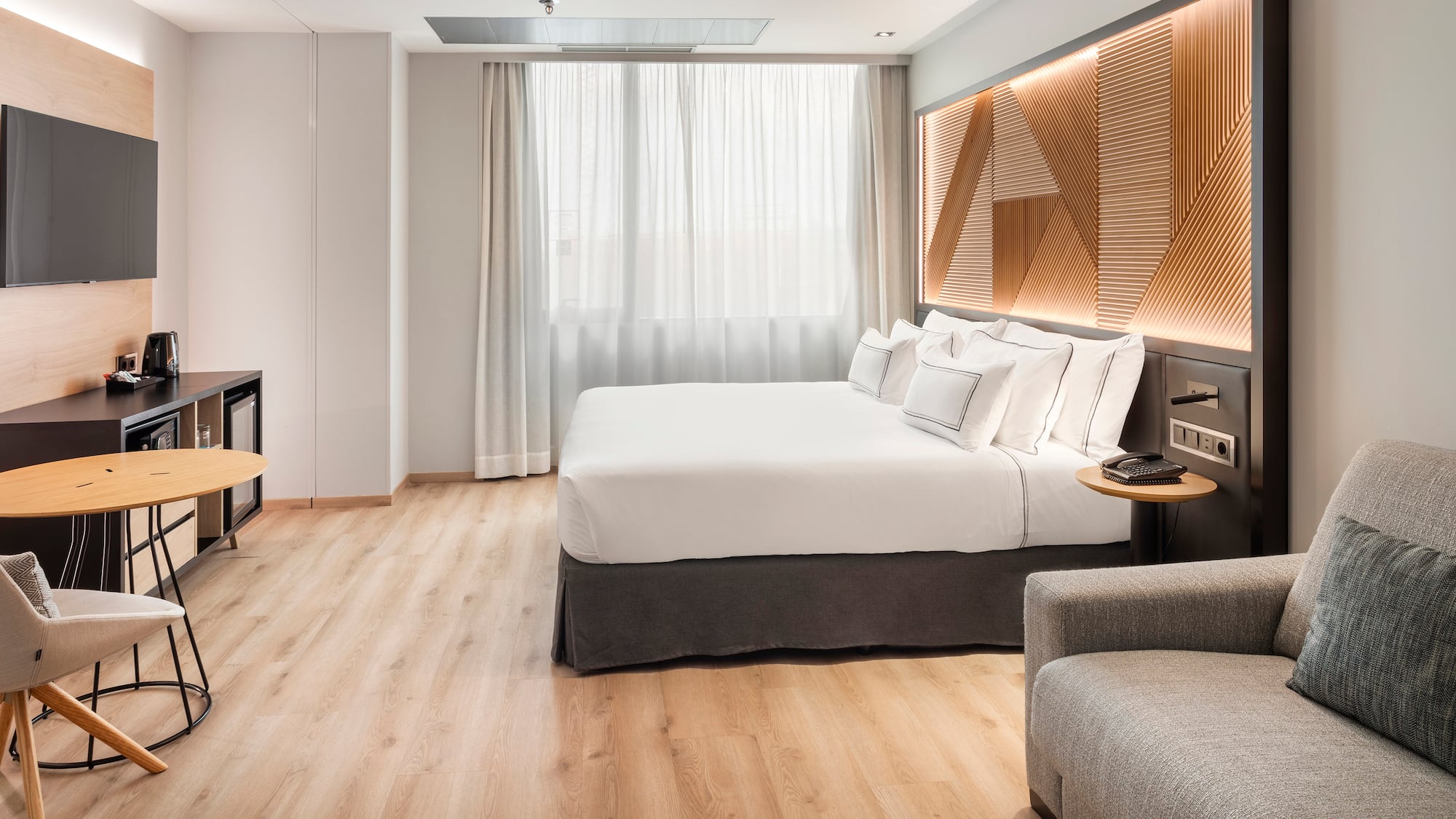 a room with a bed and a tv