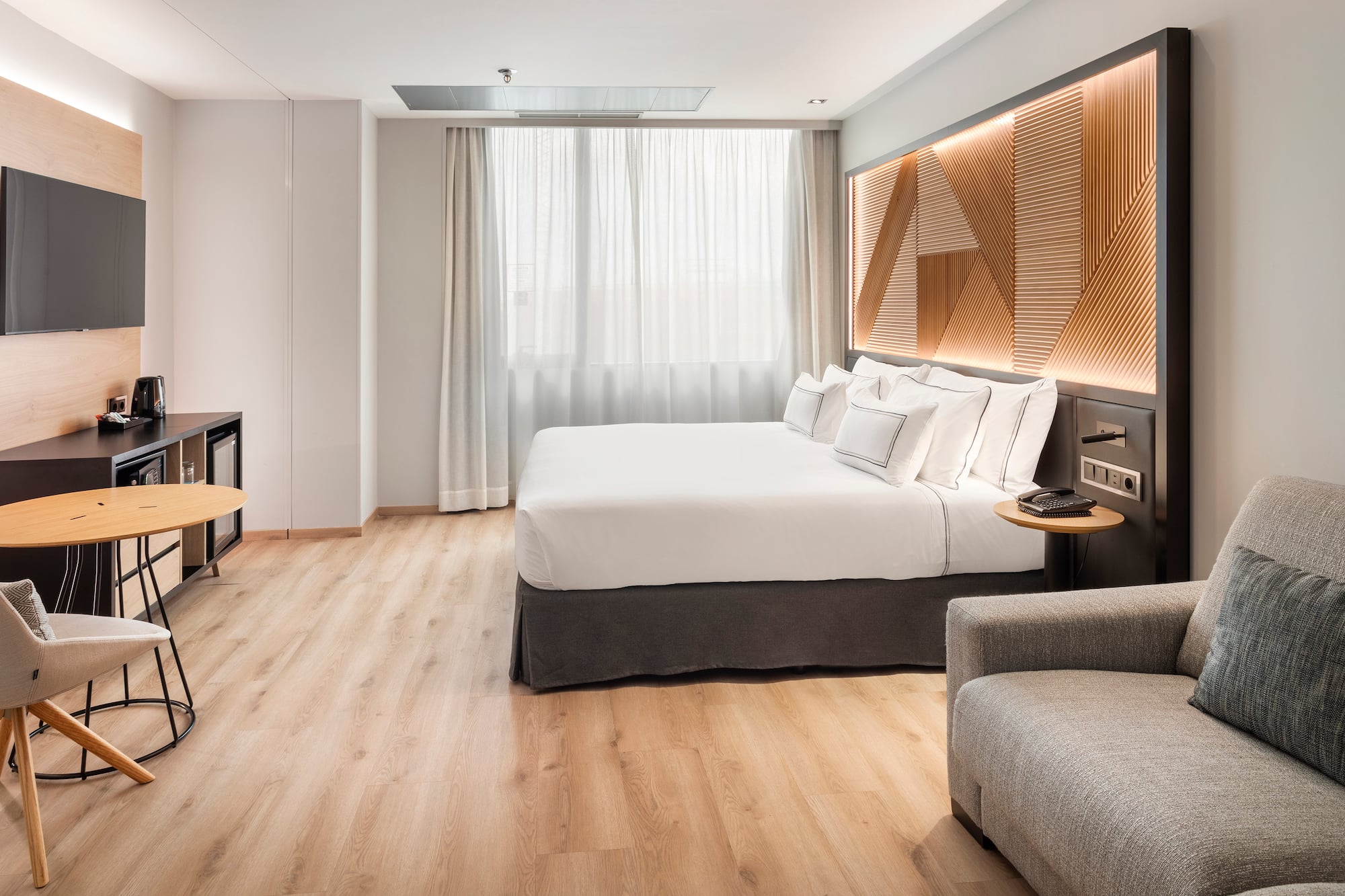 a room with a bed and a tv