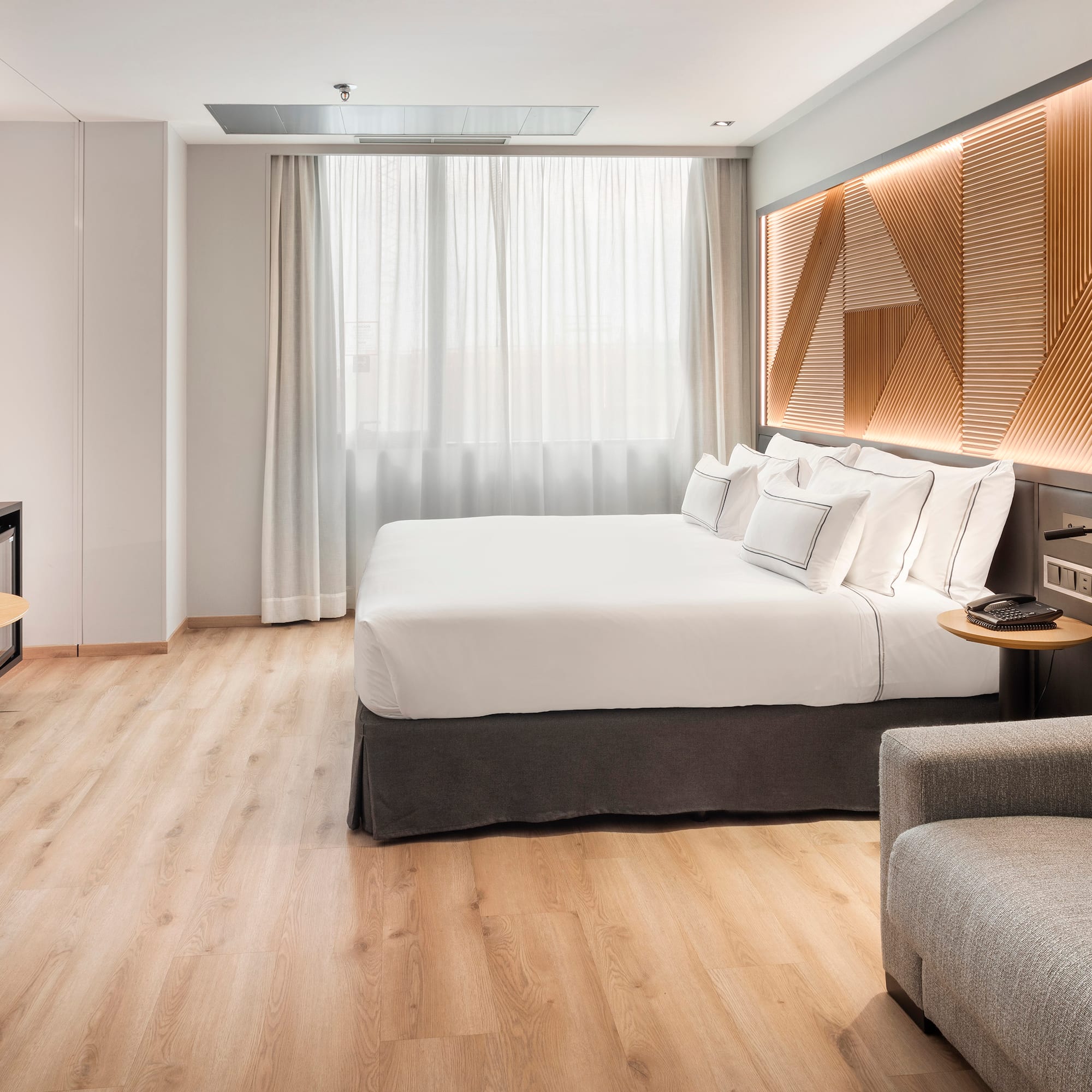 a room with a bed and a tv